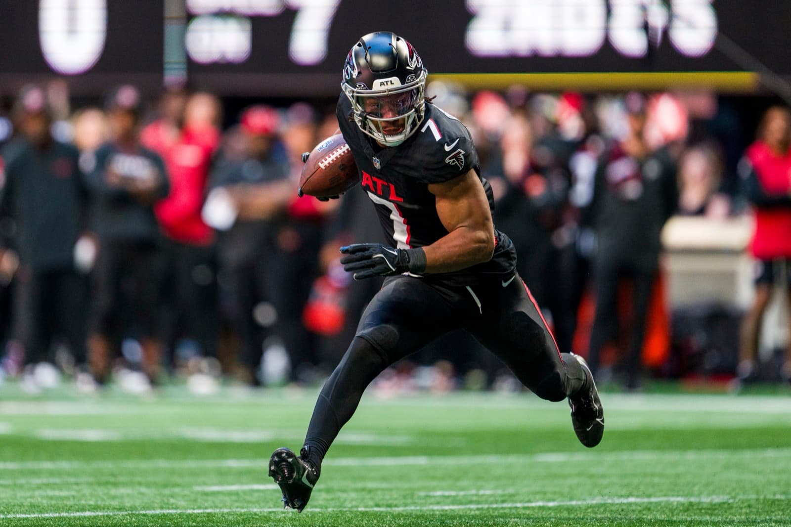 A running back breaking into the open field