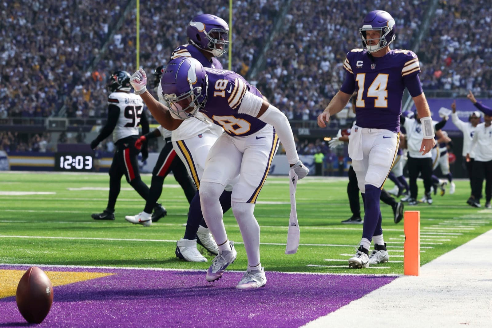 A wide receiver breaking into the open field